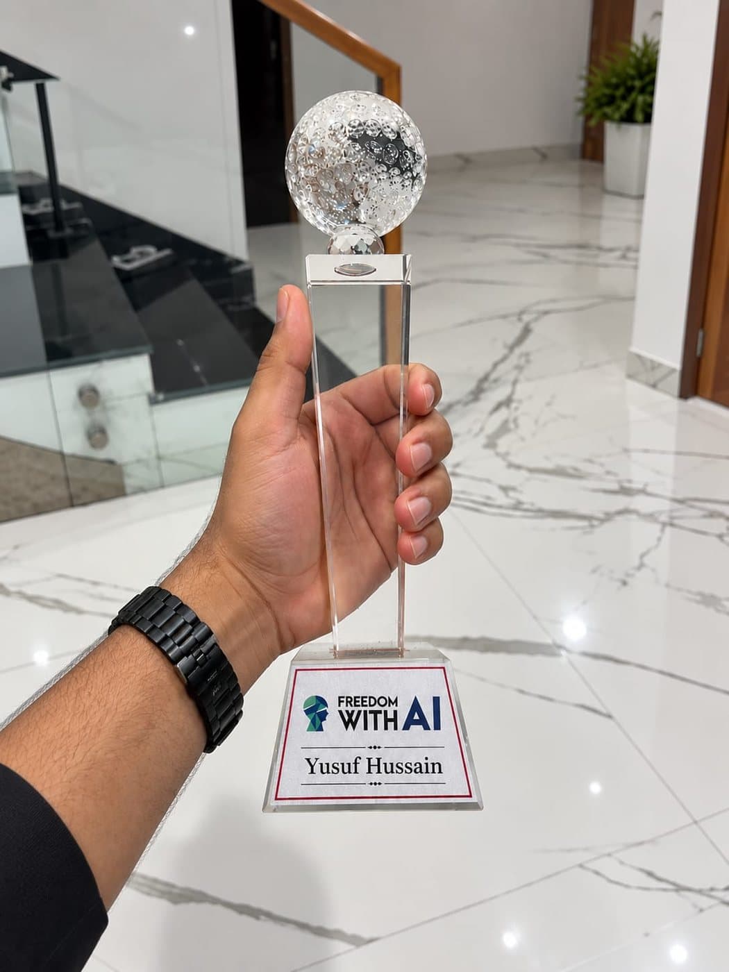 Freedom With AI trophy engraved with Yusuf Hussain's name